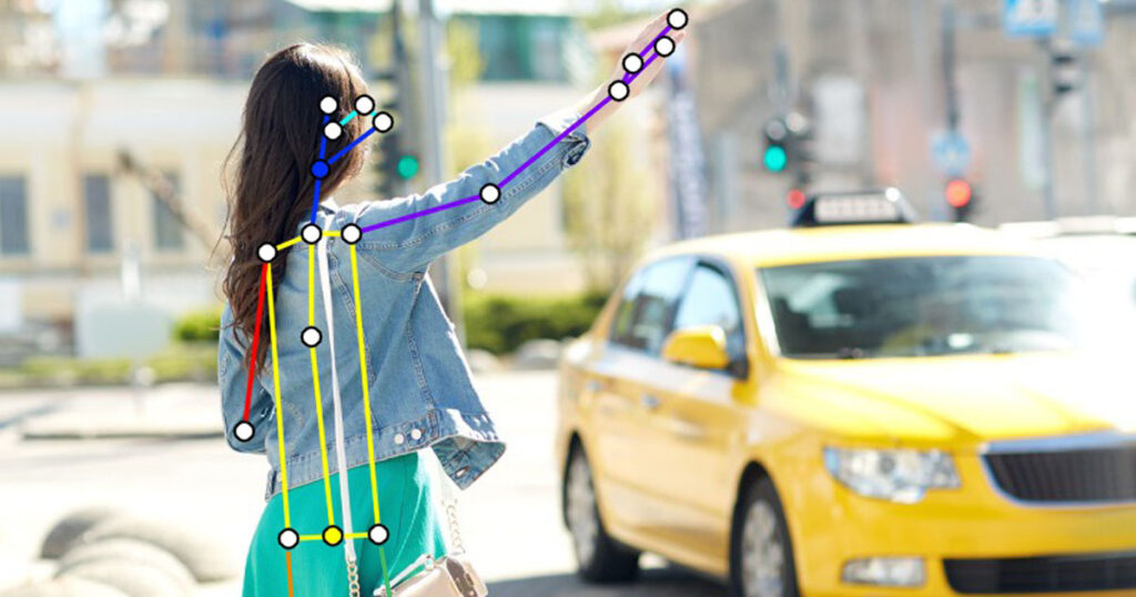 Image of a person being pose estimated while trying to hail a taxi by hand sign.